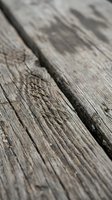 Weathered wooden planks with natural grain texture and rustic surface details for construction and design projects.