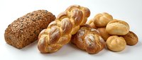 Assorted fresh baked bread loaves and rolls including whole grain, braided, and round rolls isolated on white background for bakery, food, and culinary design projects.