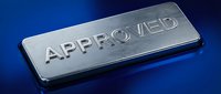 Metallic approved stamp on blue background, representing business certification, quality assurance, and official authorization for corporate documents and compliance materials.