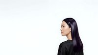 Asian woman with long black hair wearing black top, shown in profile view against white background, isolated for design use on apparel, marketing materials, and digital projects.