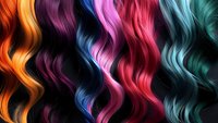 Vibrant wavy strands of multicolored hair showing rainbow spectrum from orange to turquoise, featuring smooth glossy texture and flowing curves on dark background.