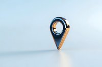 Metallic blue and gold location pin marker icon on light background, modern minimalist design for apps and digital navigation interfaces.