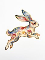 Leaping rabbit with ornate floral and swirl patterns in blue, red, and gold, isolated on transparent background. Great for stickers, sublimation, and t-shirt design.