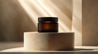 Amber glass cosmetic jar on beige concrete podium with dramatic diagonal sunlight and shadows creating minimalist luxury product presentation.