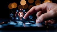 Male hand touching digital screen with glowing dollar sign and financial technology icons floating above mobile device against dark background with bokeh lights.