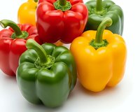 Fresh colorful bell peppers red yellow green isolated on white background for healthy cooking recipes and organic vegetable nutrition concepts.