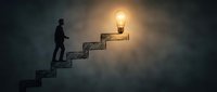 Businessman climbing stairs toward glowing lightbulb representing success, innovation and career growth in conceptual leadership illustration.