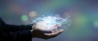 Businessman hand holding glowing digital cube with connected network lines, representing innovation, technology, and data processing for business solutions.