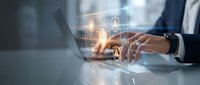 Businessman's hand touching laptop keyboard with glowing security padlock icons floating above screen, representing digital protection and cybersecurity solutions for business.