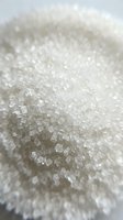 Granulated white sugar crystals in close-up detail, showing texture and sparkle. Suitable for food, baking, culinary, and ingredient photography projects.