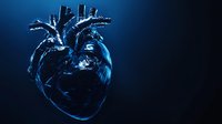 Anatomically accurate heart rendered in dark blue glass-like material with internal glow effect against black background, creating dramatic medical visualization.