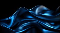Luminous blue silk fabric flowing in waves against black background creates dramatic contrast and ethereal movement for luxury fashion and abstract designs.