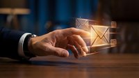 Male hand in business suit selecting glowing email envelope icons floating above wooden desk surface, representing digital communication, inbox management, and electronic messaging technology.
