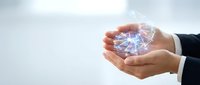 Businessman hands protecting glowing digital network connections representing cybersecurity, data protection and technology innovation concepts.