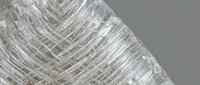 Transparent crystal clear plastic wrap film with crinkled texture and reflective surface creating abstract geometric patterns for packaging design.