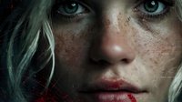 Young blonde woman with freckles and striking blue eyes, dramatic lighting creates mysterious atmosphere for fantasy or horror themed projects.