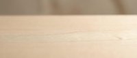 Wooden surface with natural grain texture and warm beige tones, suitable for backgrounds, product displays, and design projects.