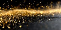 Luxurious golden glitter particles scattered on dark background with bokeh effect, creating elegant festive atmosphere for luxury design projects.