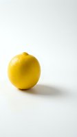 Fresh yellow lemon isolated on white background with natural shadow. Bright citrus fruit for healthy eating, cooking and beverage concepts.