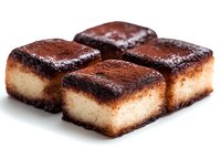 Fresh chocolate brownie cheesecake squares dusted with cocoa powder and powdered sugar on white background, close-up view showing rich, creamy texture.