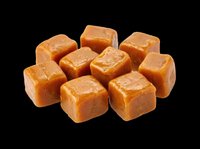 Caramel candy cubes isolated on transparent background, ready for design use on t-shirts, stickers, print-on-demand products, sublimation, and digital crafts.