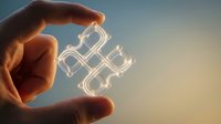 Hand holding glowing neon puzzle pieces against sky background, symbolizing problem solving, innovation, and business solutions for corporate and technology concepts.