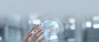Businessman hands holding holographic globe with network connections in modern office environment for global business and technology concepts.