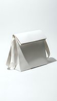 Minimalist white leather structured shoulder bag with geometric design and ribbon strap, isolated on light background for fashion and accessory concepts.