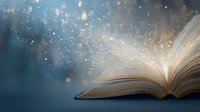 Open book with glowing magical light and sparkling dust particles rising from pages against dark blue background, creating mystical atmosphere.