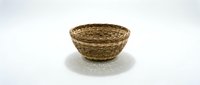 Empty wicker basket made from natural woven materials isolated on white background for home decor and storage solutions.