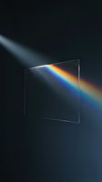 Glass prism dispersing white light into rainbow spectrum on dark background for physics education and optical science concepts.