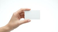Hand holding blank white business card mockup on clean background for branding and corporate identity design projects.