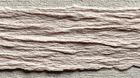 Natural beige rope texture with horizontal twisted fibers creating organic pattern for nautical maritime crafts and rustic design projects.