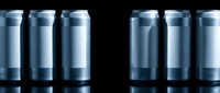 Metallic silver aluminum cans arranged in rows on reflective surface with dramatic lighting for beverage packaging and industrial design concepts.
