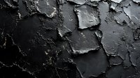 Dark cracked and peeling paint texture on old wall surface creates dramatic abstract background with deep shadows and rough textural detail.