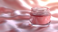 Pink cosmetic cream jar on silky fabric background with soft light and reflections, luxury skincare product packaging for beauty and wellness industry.