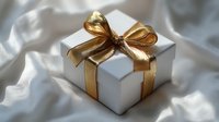 White gift box with elegant gold ribbon bow on soft fabric background for special occasions and celebrations.