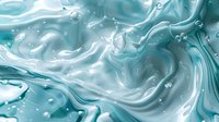 Swirling turquoise liquid with bubbles and white foam creates dynamic abstract pattern. Marbled fluid texture with flowing movement and light effects for cosmetic backgrounds.