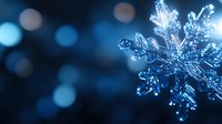 Crystal clear snowflake with intricate ice formations against soft blue bokeh background for winter holiday decorations and seasonal designs.