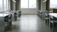 Modern open office workspace with polished concrete flooring, minimalist workstations, floor-to-ceiling windows, and industrial lighting for corporate environments.