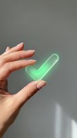 Female hands holding glowing green checkmark symbol representing approval, success, and positive confirmation for business and technology concepts.