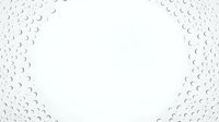 Water droplets on transparent glass surface creating abstract pattern with white background space for text or design elements.