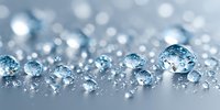 Sparkling diamonds scattered on reflective surface with brilliant bokeh lights creating luxury jewelry background for premium design projects.