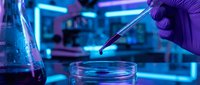 Scientist in purple gloves pipetting blue liquid into petri dish in neon-lit laboratory setting for research, biotechnology, and scientific study.
