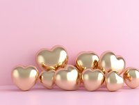Golden metallic hearts arranged in decorative composition on pink background. Romantic luxury concept for valentines day cards, wedding invitations and love designs.