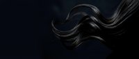 Flowing dark hair strands in motion against black background for beauty and haircare concepts.