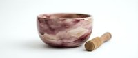 Handcrafted wooden bowl with natural burgundy and cream grain patterns, paired with a wooden pestle on white background, ready for culinary or decorative use.
