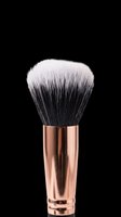 Makeup brush with rose gold metallic handle and black-to-white ombre synthetic bristles, isolated on transparent background. Ready for beauty product design, clipart, t-shirt graphics, stickers, and print-on-demand applications.