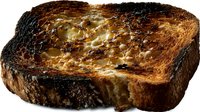 Melted butter drips down crispy golden-brown toast slice with charred edges and rich caramelized surface, creating appetizing breakfast or brunch food photography.
