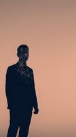 Male professional silhouette with digital network overlay on warm gradient background, representing artificial intelligence, data connectivity, and modern business technology solutions.